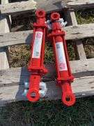 Pair of UNUSED hydraulic cylinders 16” centre pin to centre pin