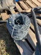 Roll of barbed wire, exhaust manifold for JD 4920 and fender brackets for same unit