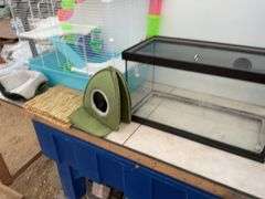 Hamster cage measures 23" long x 18" high x 13" wide, aquarium measures 20" long x 11" wide x 12" hi