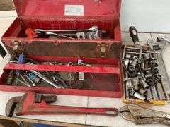 Toolbox comes with a quantity of miscellaneous tools including pipe wrench, crescent wrench, wheel w