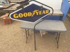 Double sided Goodyear sign, sign overall measures 40" x 20”, comes with a hanger stand