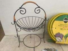 Unused 50' garden hose, ornamental iron plant stand, unused steak knives