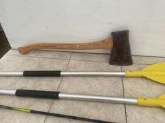 Pair of aluminum shoreline paddles, ax, fishing rod and reel