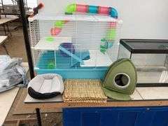 Hamster cage measures 23" long x 18" high x 13" wide, aquarium measures 20" long x 11" wide x 12" hi