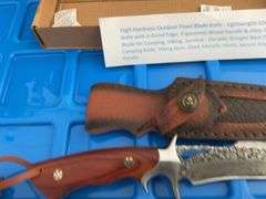 Fixed blade Damascus knife approximately 5” blade