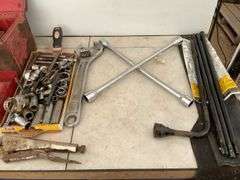 Toolbox comes with a quantity of miscellaneous tools including pipe wrench, crescent wrench, wheel w