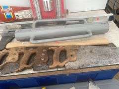 Post pounder, axe, quantity of hand saws, levels, hand mitre saw, trowels etc.