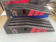 A pair of unused car ramps rated at 13,000 lbs