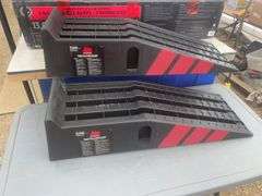 A pair of unused car ramps rated at 13,000 lbs