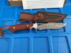 Fixed blade Damascus knife approximately 5” blade