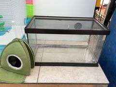 Hamster cage measures 23" long x 18" high x 13" wide, aquarium measures 20" long x 11" wide x 12" hi