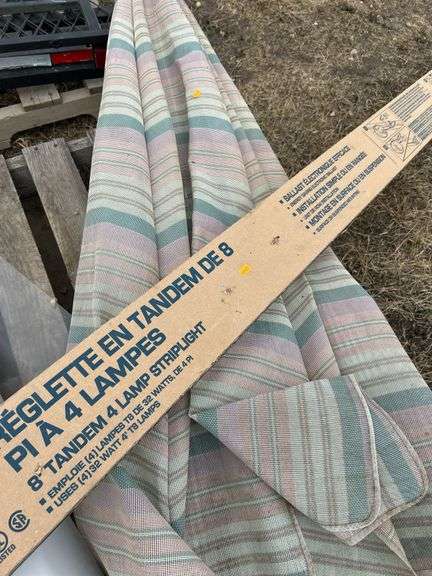 Pallet with arborite, patio umbrella, 8ft T8 light fixture, roll of poly