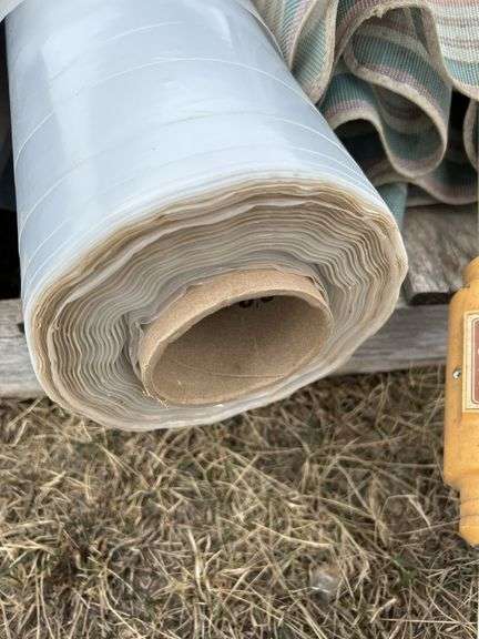 Pallet with arborite, patio umbrella, 8ft T8 light fixture, roll of poly