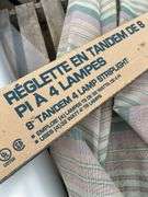 Pallet with arborite, patio umbrella, 8ft T8 light fixture, roll of poly