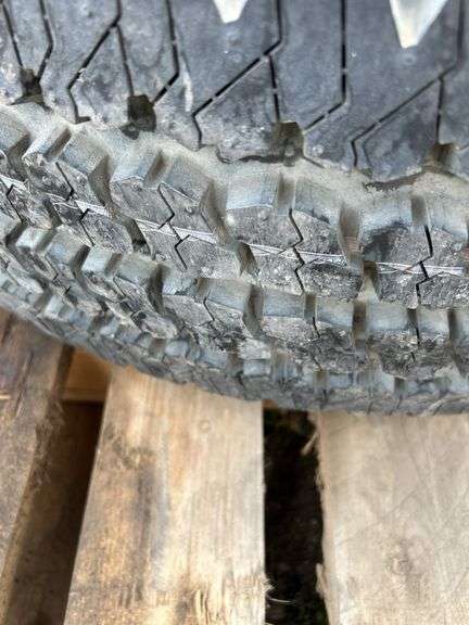 Bridgestone tire and rim -LT265/75R16 and Polaris bag