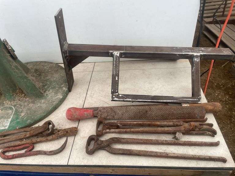Saddle stand for wall mount, hoof jack, quantity of shoeing tools