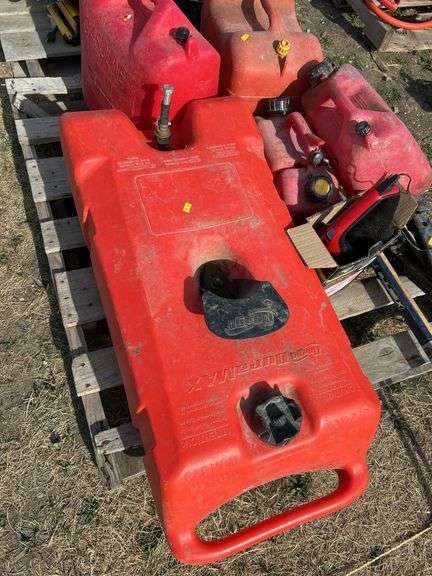 Pallet with gas cans, hockey sticks etc.