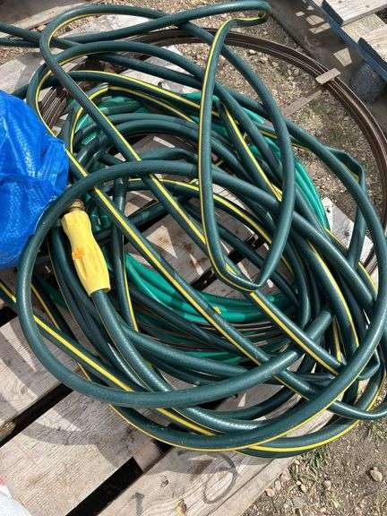 Pallet of misc black poly pipe fittings, garden hose, sewer snake