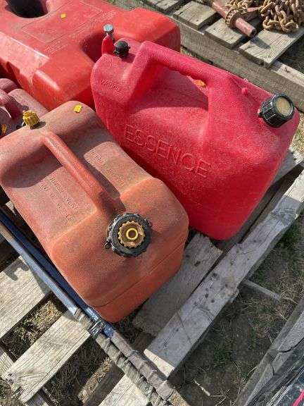 Pallet with gas cans, hockey sticks etc.