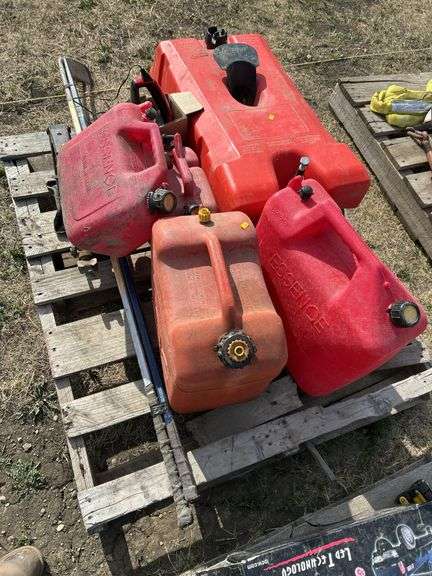 Pallet with gas cans, hockey sticks etc.