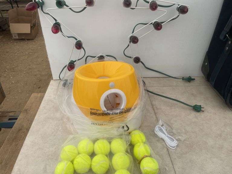 2' Christmas star, ball launcher and some balls, 26" high garment bag on wheels