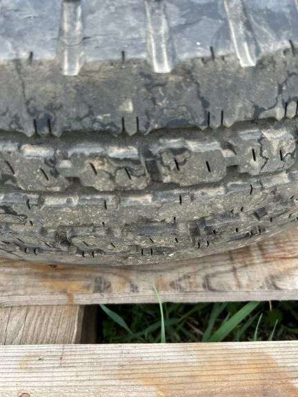 1 trailer tire on steel wheel - ST225/75D-15