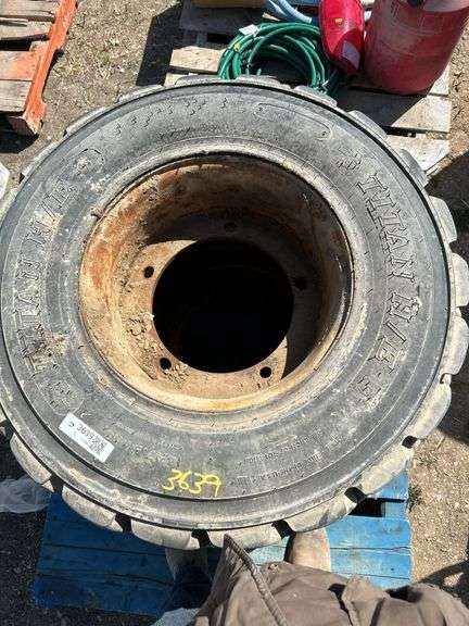 2 tires and rim 14-17.5NHS