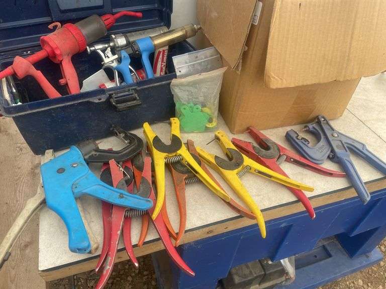 Large quantity of ear tags  and installer pliers, vaccination syringes