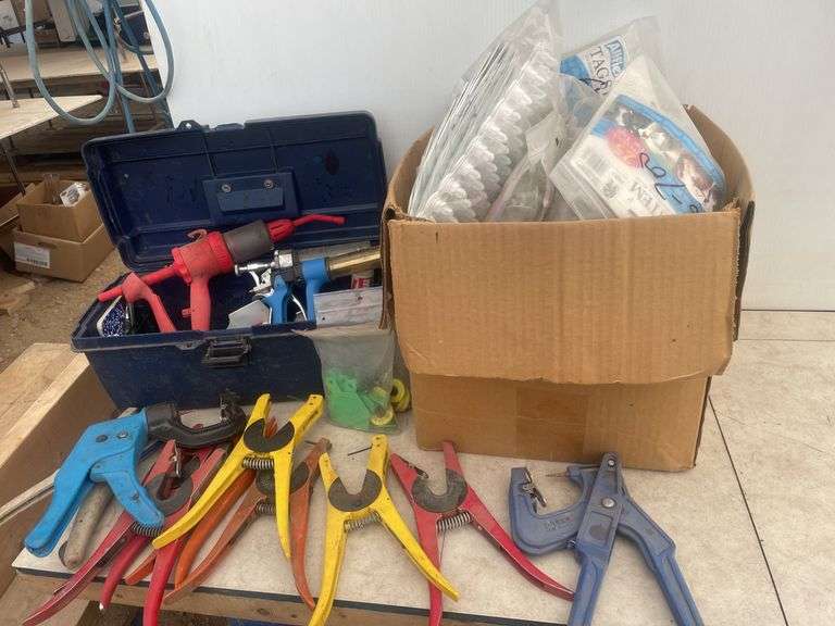 Large quantity of ear tags  and installer pliers, vaccination syringes