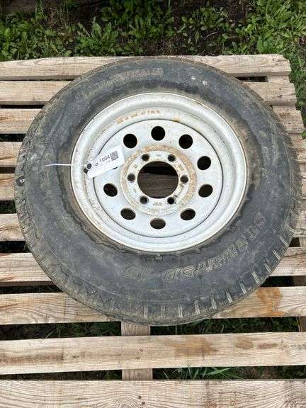 1 trailer tire on steel wheel - ST225/75D-15