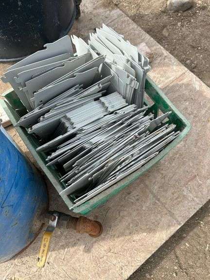 Pallet with 2 steel barrels with drains and milk crate of metal shelving dividers