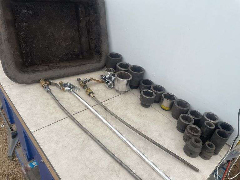 Quantity of 3/4" drive sockets mostly impact, 3 extended blow guns in a tub