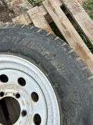 1 trailer tire on steel wheel - ST225/75D-15