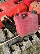 Pallet with gas cans, hockey sticks etc.