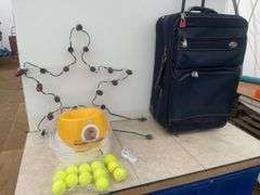 2' Christmas star, ball launcher and some balls, 26" high garment bag on wheels