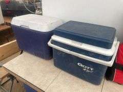 A pair of coolers and a size small life jacket