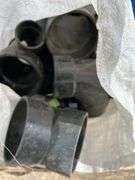 Pallet of misc black poly pipe fittings, garden hose, sewer snake