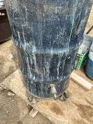 Pallet with 2 steel barrels with drains and milk crate of metal shelving dividers