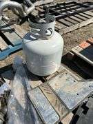Pallet with mud flaps with battery box, booster cables, ball reciever, propane tank etc.