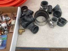 Roll of 1/2" orange pex, quantity of plumbing fittings in metal box