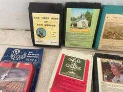 Quantity of 8 track tapes including cassette to 8 track adapter, head cleaner, Christmas music etc.
