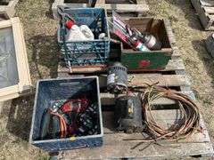 pallet with grease guns, power tools, bbq burner, electric motors
