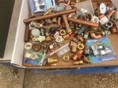 Roll of 1/2" orange pex, quantity of plumbing fittings in metal box