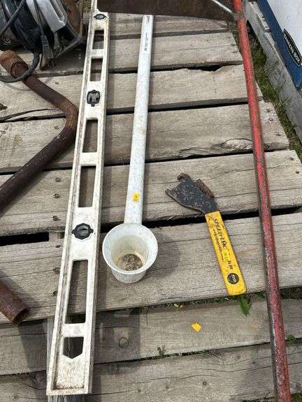 Pallet of misc skilsaw, grain box corner scoop, level etc