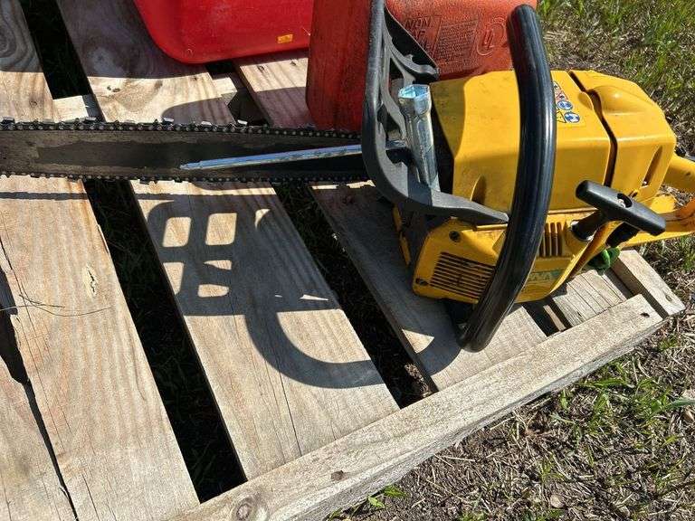 Pallet with gas cans, post maul, chainsaw - condition unknown
