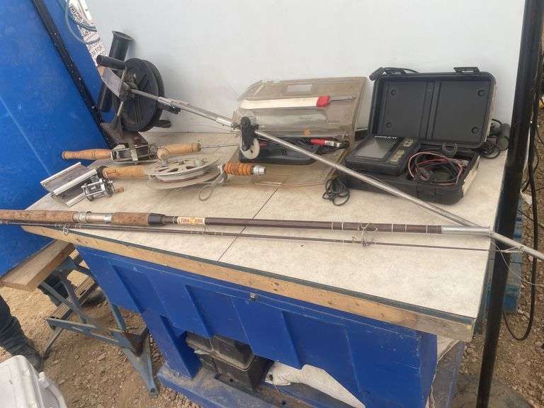 Quantity of deep water fishing rods, 12V filleting knife, and an Eagle fish finder - condition unkno
