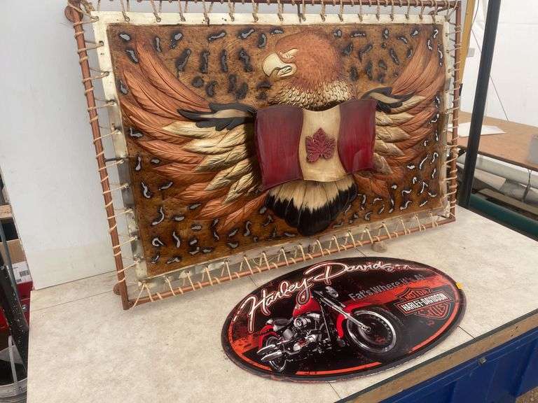 36" x 23" metal picture that lights up and a 22" oval Harley Davidson metal plaque