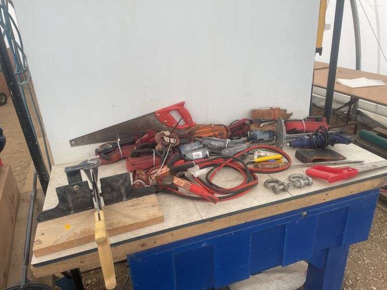 Quantity of tie downs, rotary tool - working, boostercables, hand mitre saw etc.