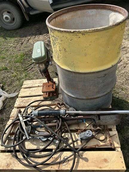 Pallet of misc, barrel, rusty bench drill press, trap etc