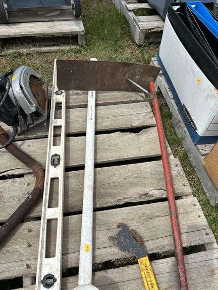 Pallet of misc skilsaw, grain box corner scoop, level etc